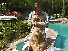 Blonde teen in cheerleader uniform gets pounded by the pool