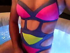 Tranny wearing sexy swimsuit in pool