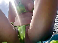 Italian Big day of slave humiliation obedient At the Beach in Florida wearing a Micro Bikini flashing her horny wet pussy and putting sunscreen on her body