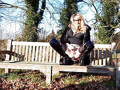 Transgender Whore Having Fun on Park Benches