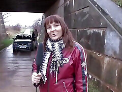 German milf outdoors is interviewed to express the pleasure she is feeling with cock in her pussy