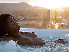 Petite Ebony MILF strips naked in a pool Petite Ebony MILF strips naked in a pool