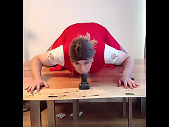 Sissy riding Black Dildo on Table