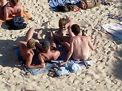Group of guys having japanes hidden camera massage on the beach