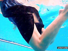 Teen girl Avenna is swimming in big size video pool