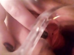 Peeing in own pussy with speculum