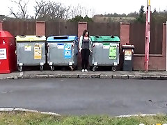 A bit pussy lips hanging out public amateur brunette gal squats down and pisses between refuse bins