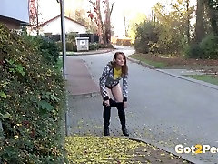Lusty black haired hooker pisses in the mid of sidewalk