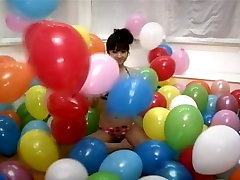 Funny Asian girlie Yuko Ogura shows her body and plays with balloons