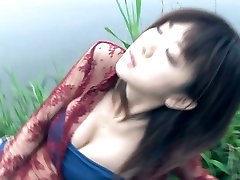 Glamorous Asian chick Aki Hoshino poses in her china masturlic coat