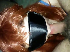 Redhead wife has oral sex with a mask