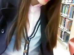 Riding red dildo on library