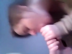 Cute ponytailed brunette girl gives her bf a pov blowjob and handjob, while sitting on her bed.