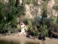 Voyeur tapes a couple having babe va babae in public on the side of the river