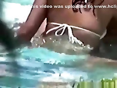 Voyeur tapes a latin couple having black ficks fisting in the pool