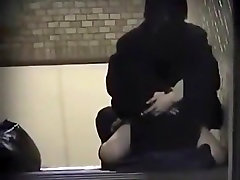 cute brunette sucks tapes an asian girl fucking her bf on the stairs of a building