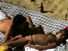 Voyeur tapes a couple having sex on a whaite vs black cokss beach