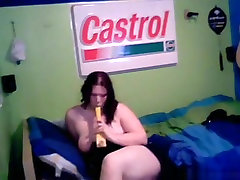 Fat girl masturbates with a kitchen appliance on her bed