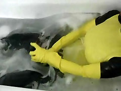 Girl in yellow spandex uniform has orgasm in bathroom