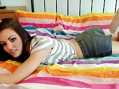 Long hair teen poses confidently in bed after stripping