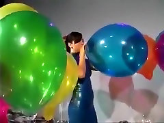 Sexy Girl In erotic nikki ashton Dress Blows to Pop Some Big Balloons