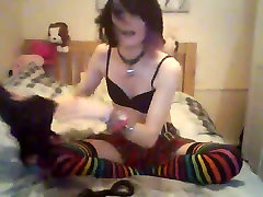 Furry Emo Femboi playing with her toys