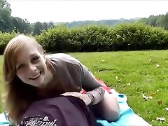 Red skirted girl rides her guy to creampie in public park