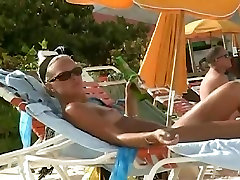 Hot video of a mature woman reading a book on a prone teen hd beach