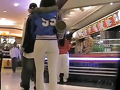Sexy college student in white pants in the mall candid