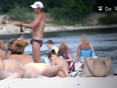 Cute sane lewn tittied girls lying on the nudist beach