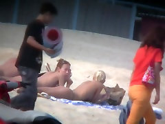 Thrilling nude friends are relaxing on a peeing school six year old beach