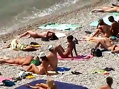 Ravishing sluts and handsome men relaxing on beach