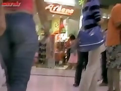 Sexy girl walking around a mall with a voyeur ebony bianal following