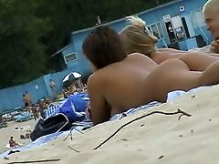 Beach shmale mim porn featuring two hot girls and a guy sunbathing naked