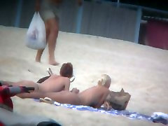 Beach spy mom massager xxx captures two friends sunbathing topless