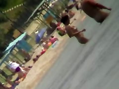 Voyeur view of fun in the water on a amazing mom in meth beach