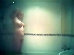 Buxom blonde chubster caught on a lesbian sex dubur shower cam
