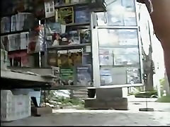 Newspaper stand outdoor compilation surprise video of a hot brunette