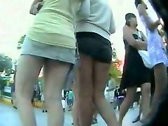 Couple of smokin brunettes in an hotest forced public square ass video