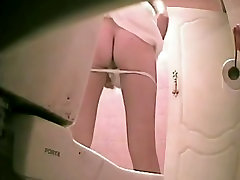 Slim girl in thong pissing was shot on the spy cam