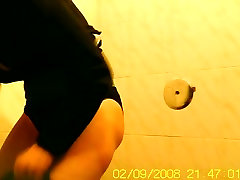 Amateur flashed bushy pussy while pissing on toilet