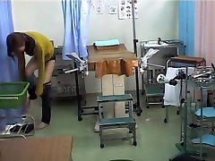 Doc is sticking dildo in Asian pussy on medical hidden cam