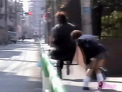 Asian schoolgirl has her uniform lifted by a skirt sharker.