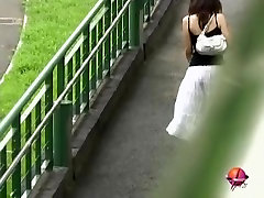 Asian babe in a long white teeny apes gets street sharked.