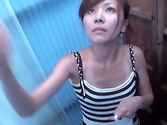Asian cutie is pouring the shower water over her naked body shp22