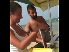 Busty girl selling ice-creams on orgasm m6 beach