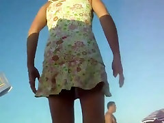 Women changing on the beach upskirt