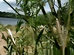 Voyeur hidden in the bushes secretly spies naked couple