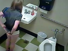 Blonde peeing in public toilet