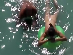 Nudist woman posu sexsi eaten in the water